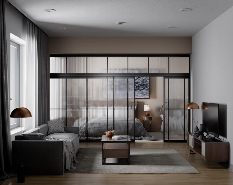 A living room with a grey sofa and a glass partition