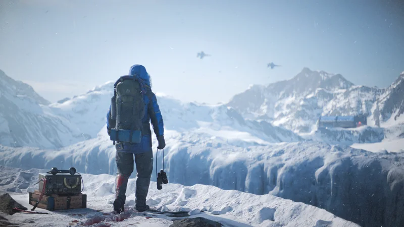 A climber looking over snowy mountains